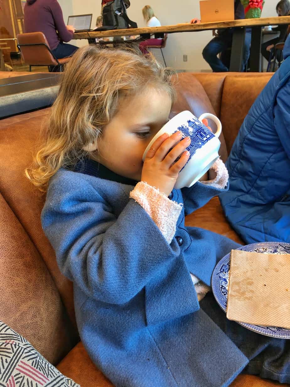 Child drinking vegan hot chocolate at Methodical Coffee in Greenville SC