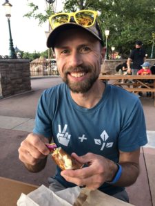 Eating a vegan pretzel in Germany at Disney World's Epcot
