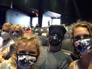 Preschooler and family inside Hollywood Studio's Frozen Sing A Long