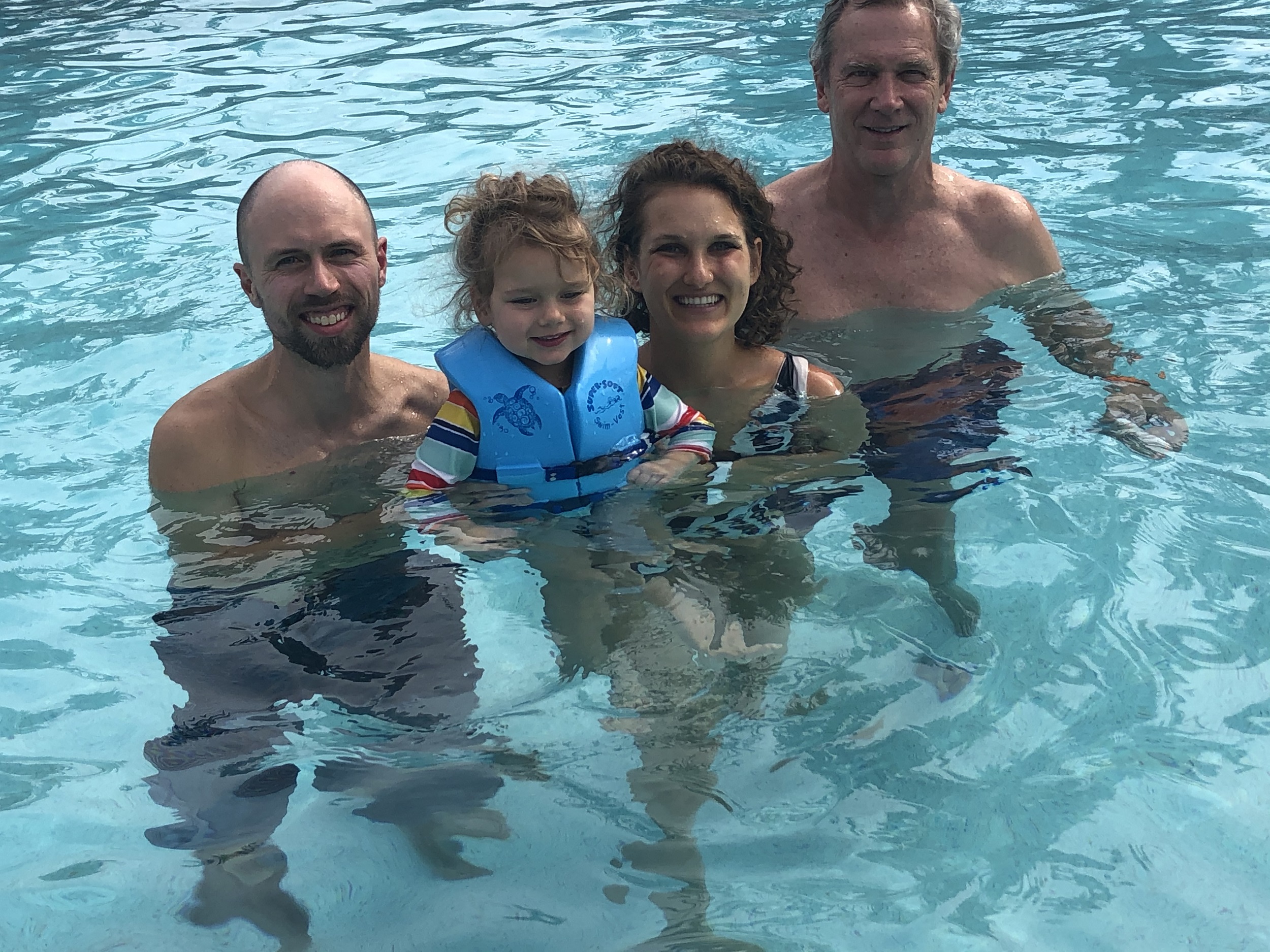 Family taking a break in the pool when in Disney with a 4 year old