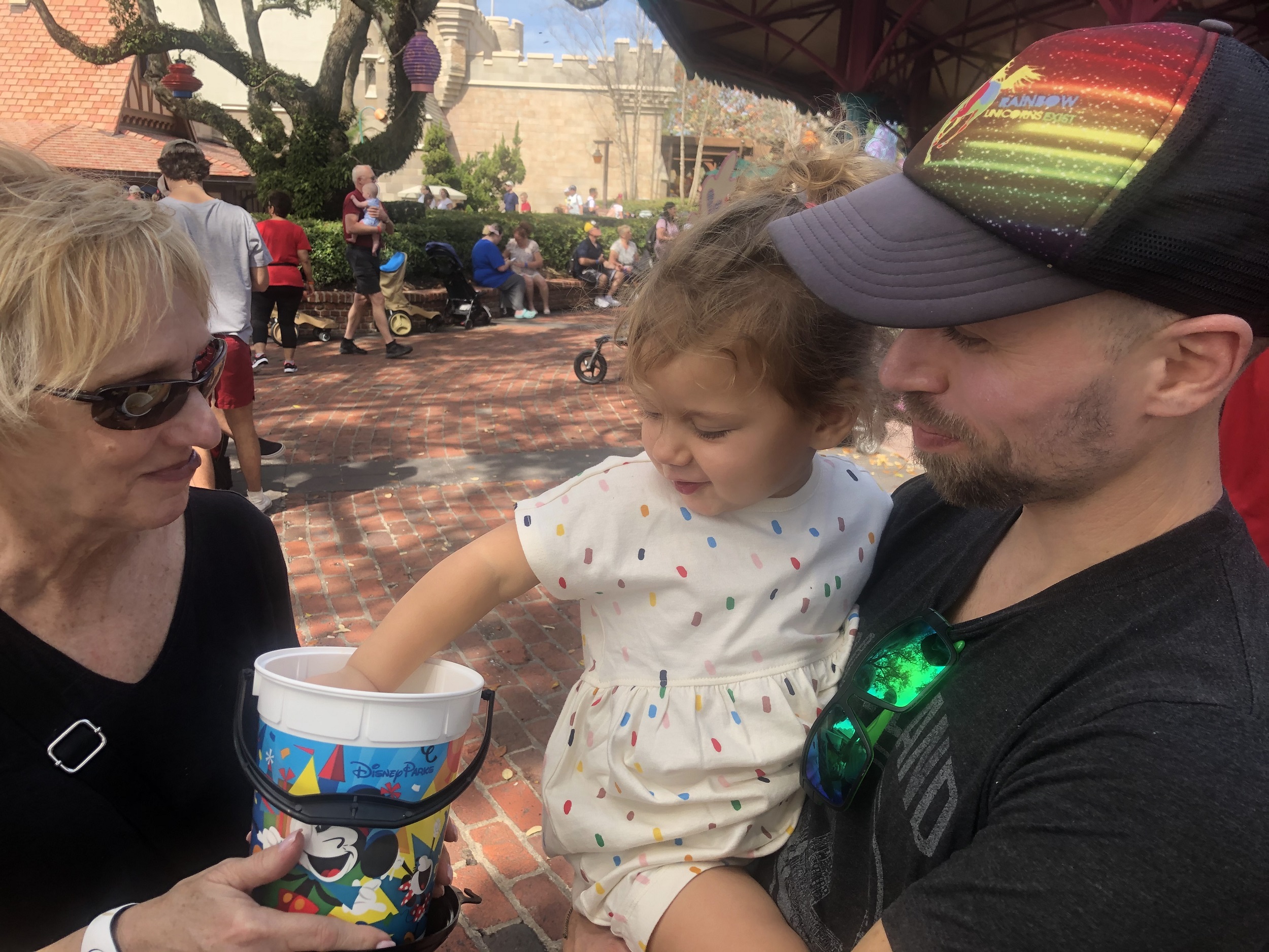 Eating popcorn from a popcorn bucket in Disney World