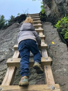 Climbing a ladder to MacRae Peak on Grandfather Mountain with kids