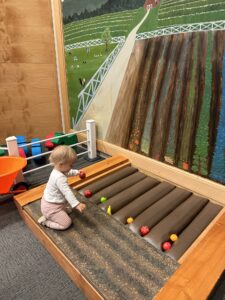 Toddler playing at the Family Interactive Gallery in Bellingham