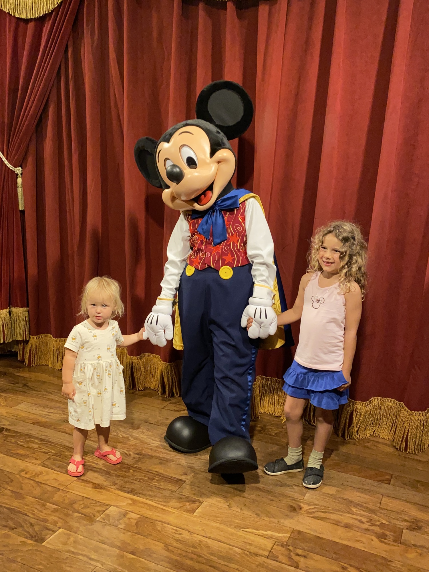 Toddler meeting Mickey in Disney World