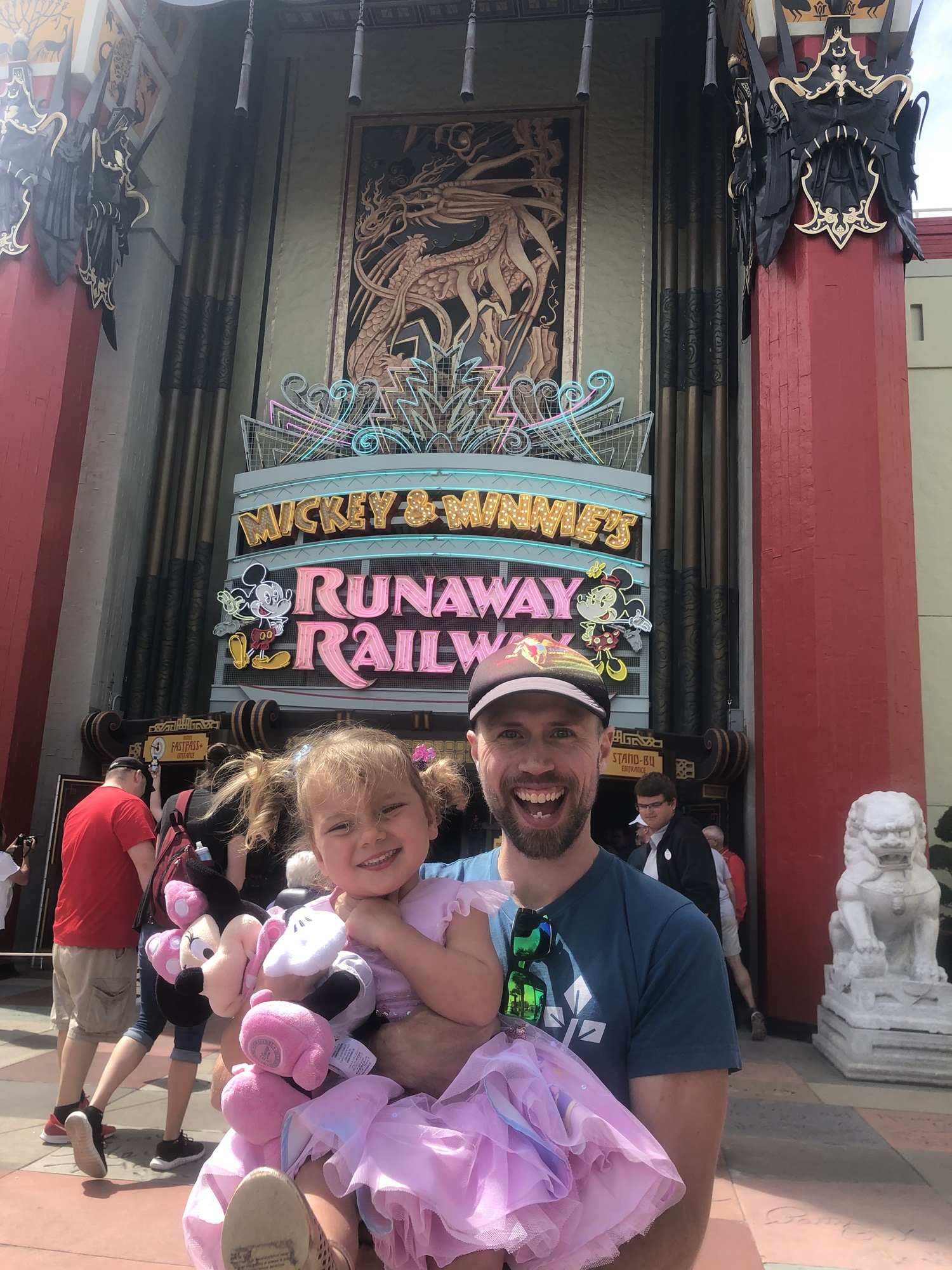 A father and daughter outside of Mickey and Minnie's Runaway Railway ride in Disney World