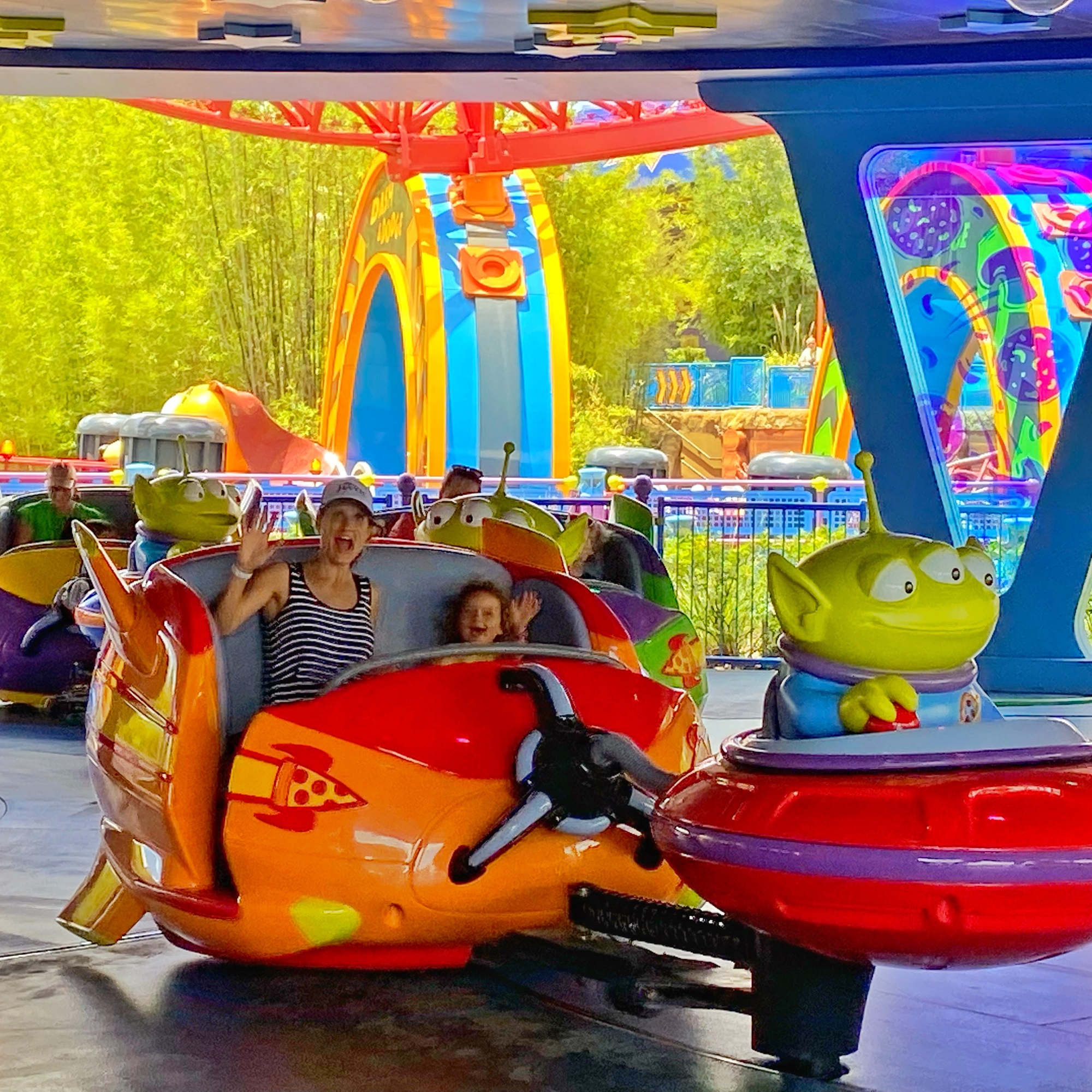 A toddler and her mother on Alien Saucer Swirl - a favorite toddler ride in Hollywood Studios at Disney World