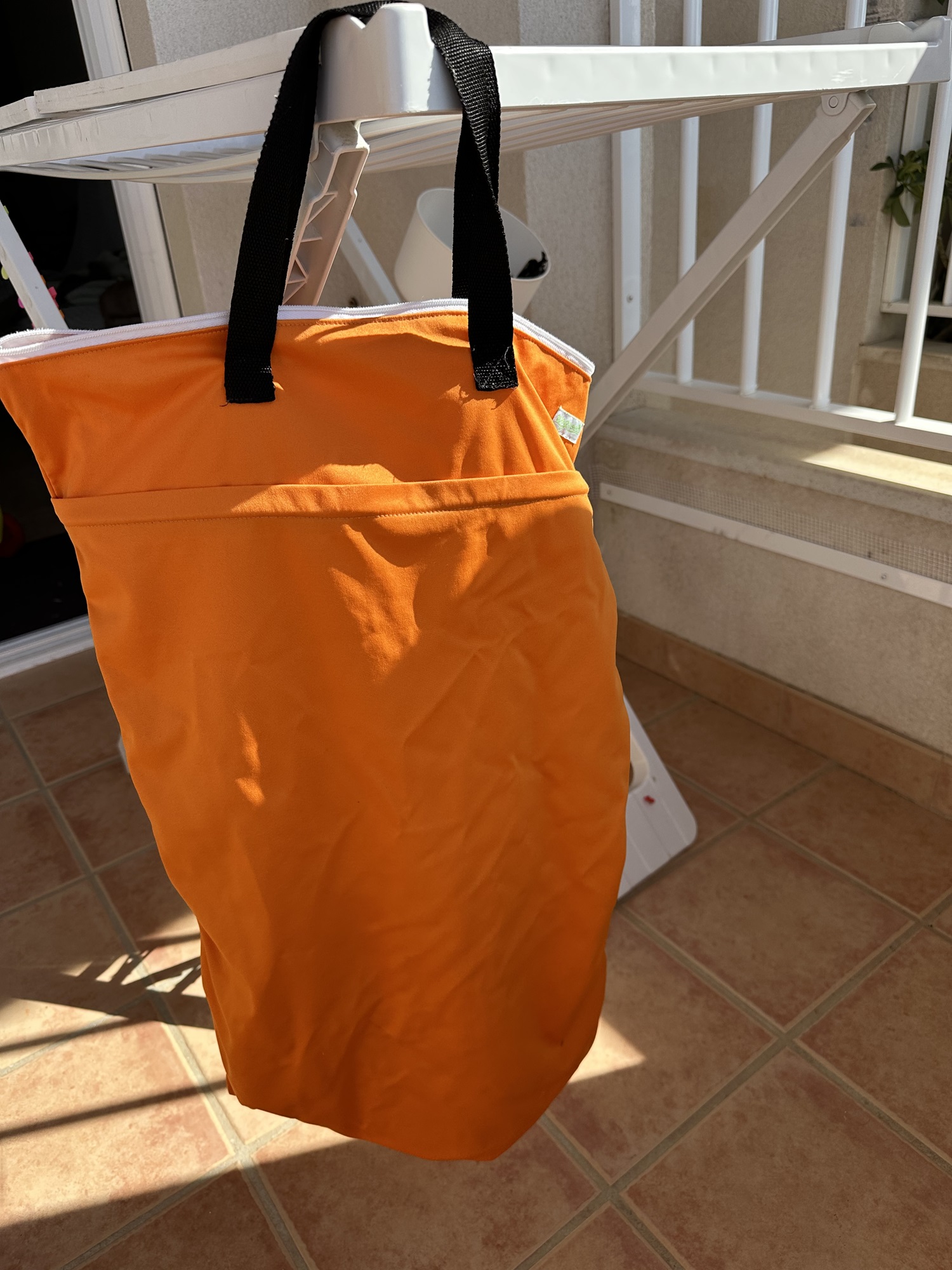 Use a wet bag with toddlers at the beach for wet swimsuits and towels