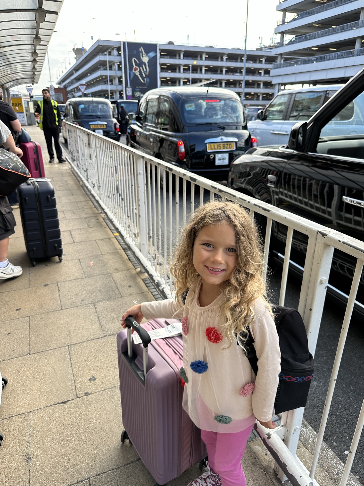 A child with her suitcase that is an appropriate size for her strength