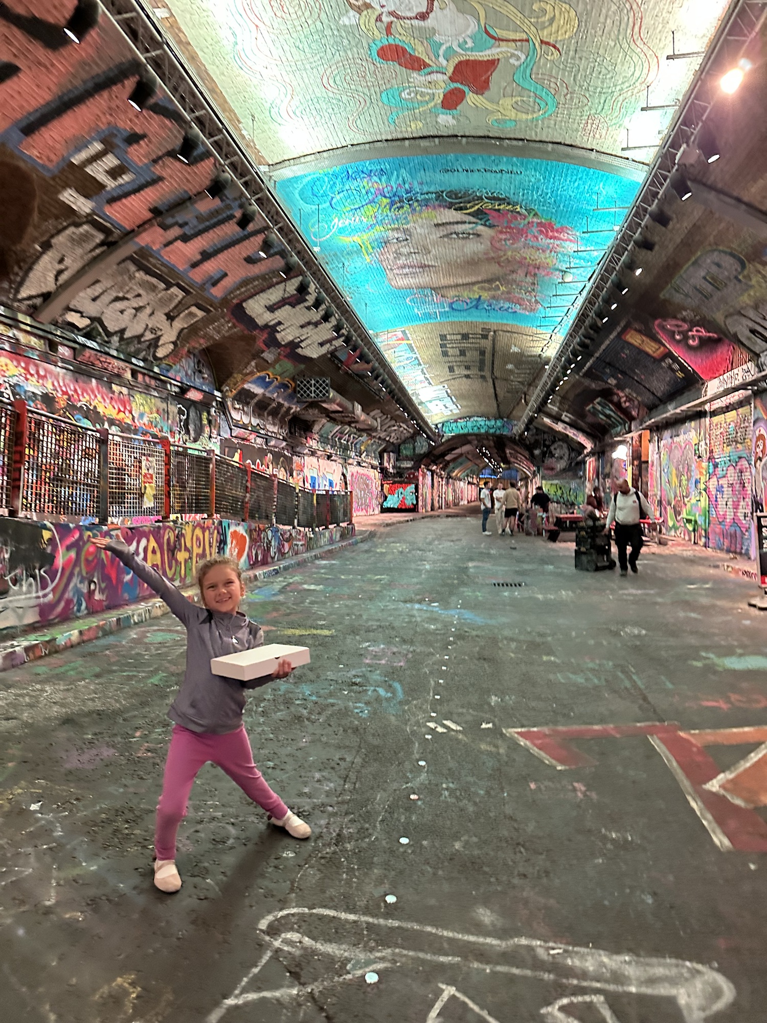 Girl exploring the Graffiti Tunnel in South Bank, London