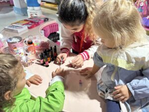 Kids get their nails done for free at Hamleys in London