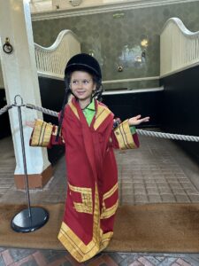 Interactive kids activities at the Royal Mews in London like dressing up like a coachman