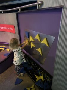 Toddler playing with magnets at the free science museum in London