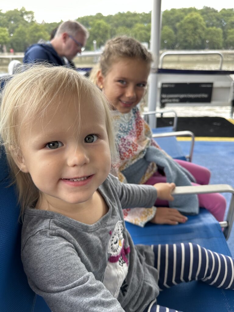 Kids riding an Uber Boat on the River Thames