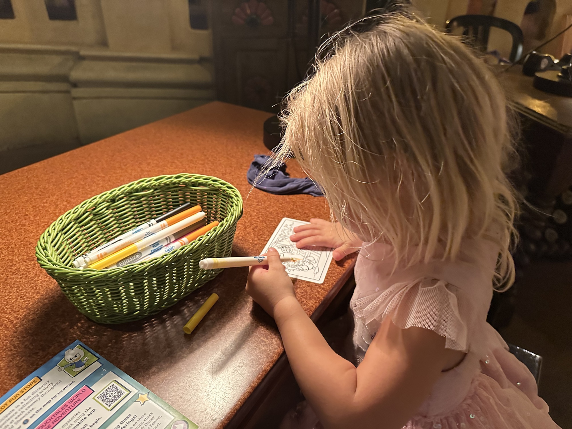 Child in Epcot coloring at at Kid Kot Fun Stop