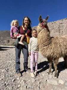 A family with a llama in Tilcara, Argentina