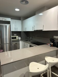 Spacious, modern, and clean kitchen of Espais Blaus apartment in Barcelona